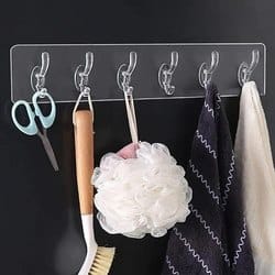 Self adhesive strip hanger